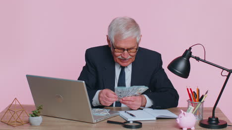 senior business office man accountant or banker making money cash calculations, income, earnings