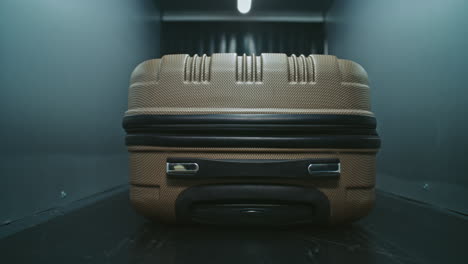 suitcase on a conveyor belt at an airport