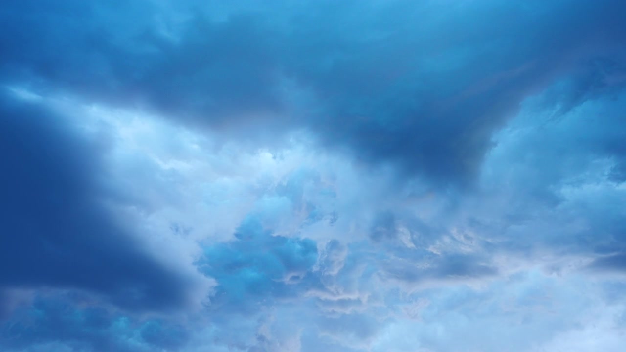 Peaceful pastel blue sky clouds seamless ambient background loop