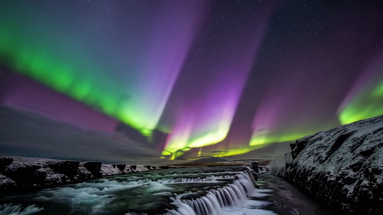 Northern Lights over a Winter Waterfall with Starry Sky