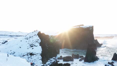 Drone-shot-of-beautiful-sunset-in-Iceland-in-winter-that-shows-the-sea-and-the-land-at-the-same-time