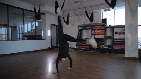 woman performing acrobatic exercises in a gym