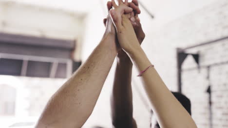 three people giving each other a high five