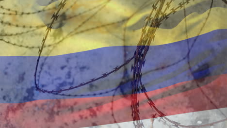 alambre de púas contra la bandera de colombia