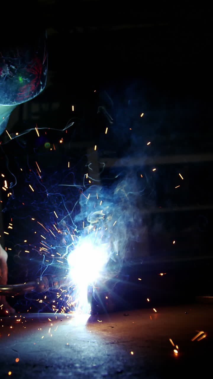 Welder working on a piece of metal