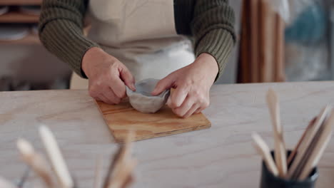 Senior-couple,-hug-and-pottery-studio-work