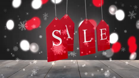 Red-sale-tags-hanging-against-glowing-background