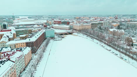 aerial wide shot of hakeniemi district in helsinki, finland in the winter