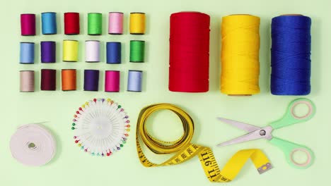 creative diy sewing and knitting items making layout on green theme. stop motion