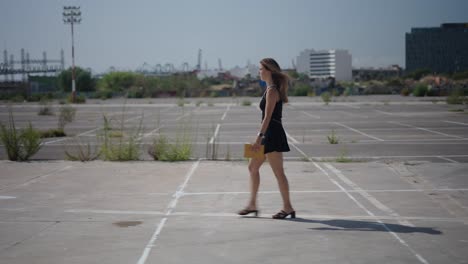 woman walking in a parking lot