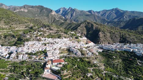 Frigiliana-white-village-in-mountains-of-Malaga,-Andalusia,-Spain---Aerial-4k