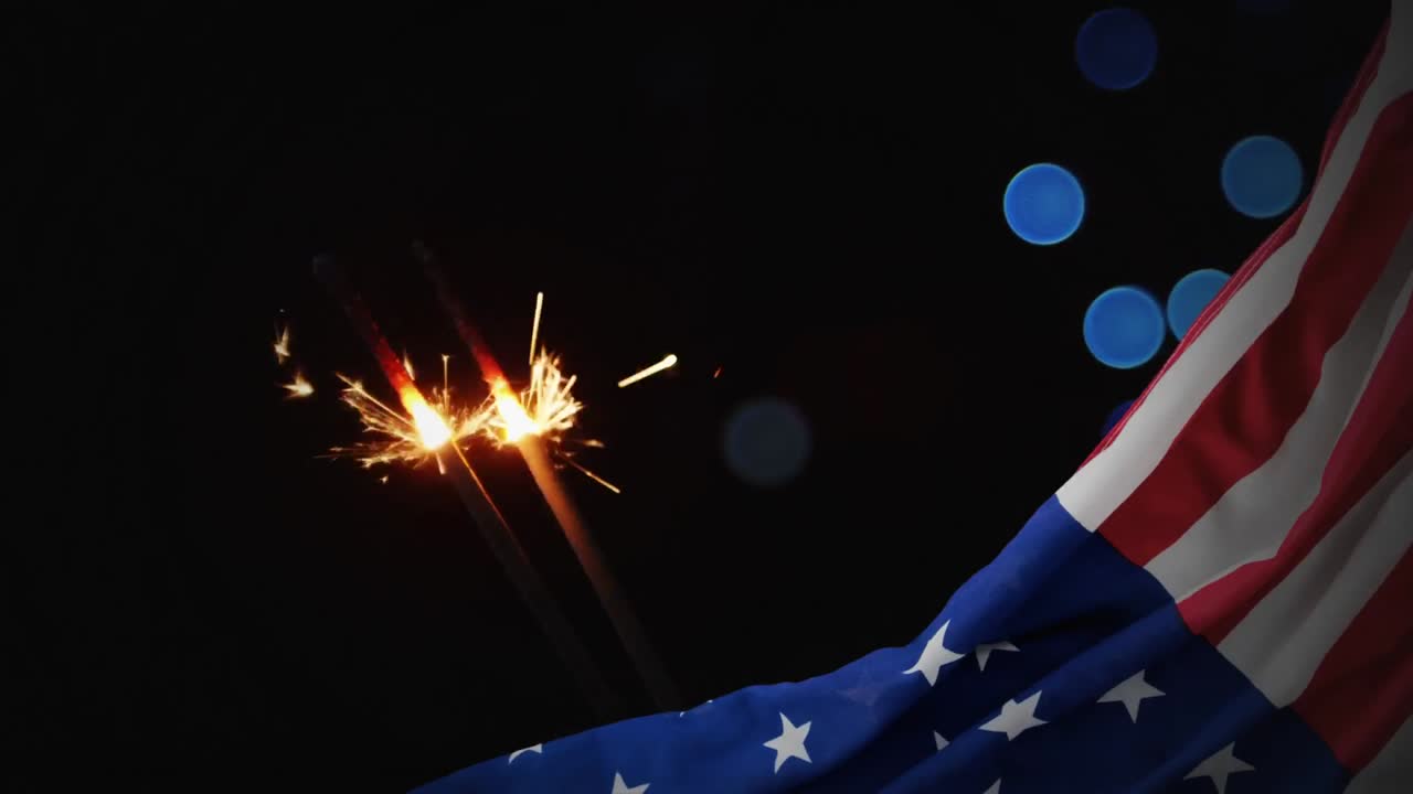 Digital animation of American flag and sparklers at night 4K