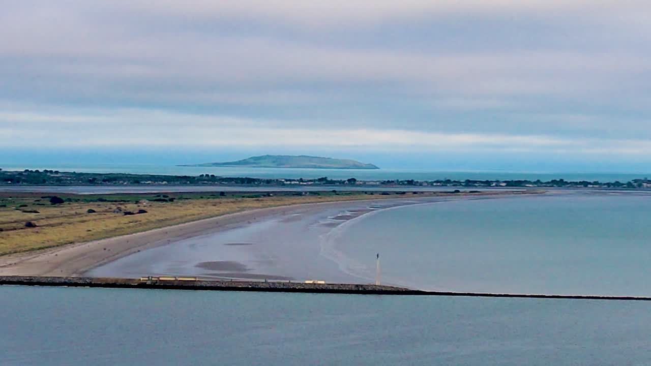 A 4K falling Drone shot of North Bull Wall Dublin Ireland