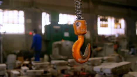 close-up of crane hook in foundry workshop 4k