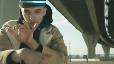 young male dancer performing hip hop outdoors