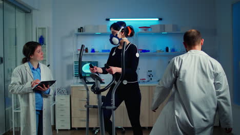 researchers monitoring vo2 of woman performance sports