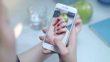 Woman-taking-mobile-video-of-manicured-nails.-Iphone-video-of-hand-manicure