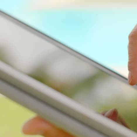 Close-Up-on-Woman-Hands-While-Using-Tablet