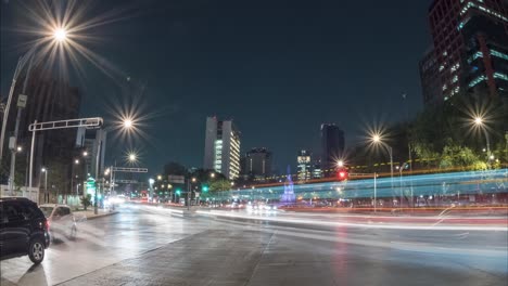nocturnal time lapse of the intersection of paseo de la reforma and avenida de los insurgentes with traffic. mexico city