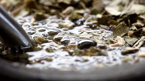 Pouring-water-into-a-"mate"-gourd