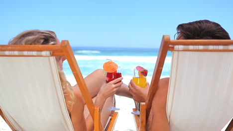 couple toasting with cocktail