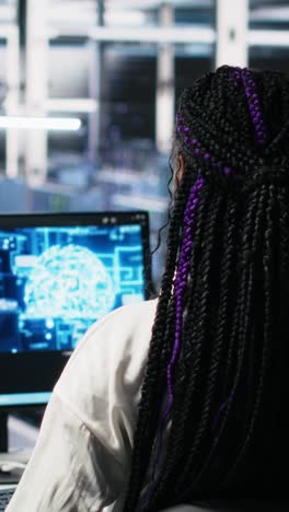 vertical video technicians in data center review ai diagnostics, analyzing neural networks