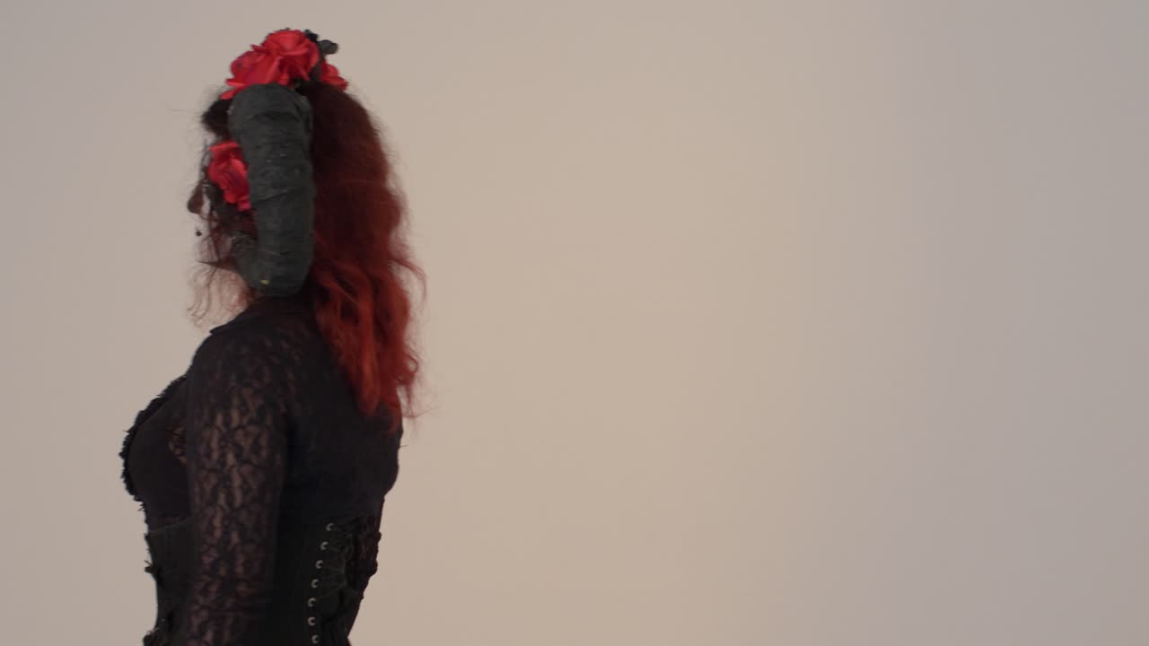 Catrina Cosplay girl passing by entering frame Right  to Left with a Light background, Medium close up