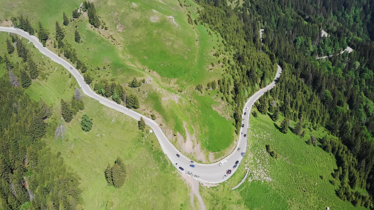 Aerial shot of a road in the mountains. Bucegi, Romania
