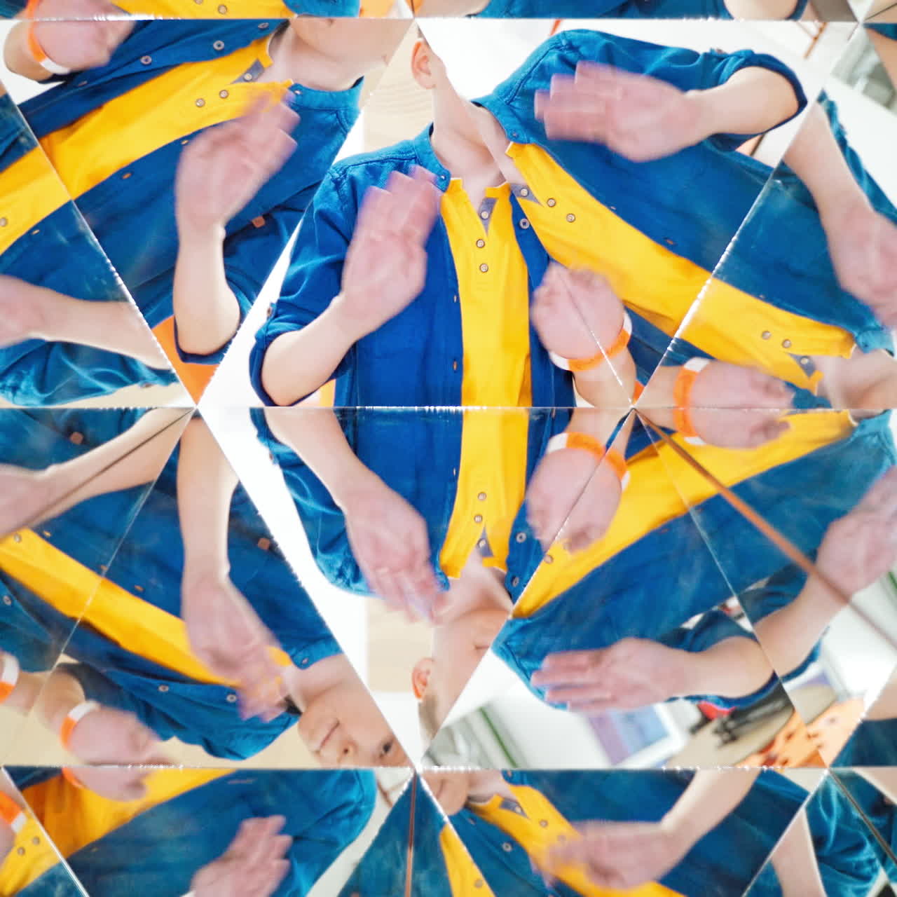 Many small triangles in kaleidoscope and curious boy in each one. Multicoloured pictures of a child in a kaleidoscope tunnel.