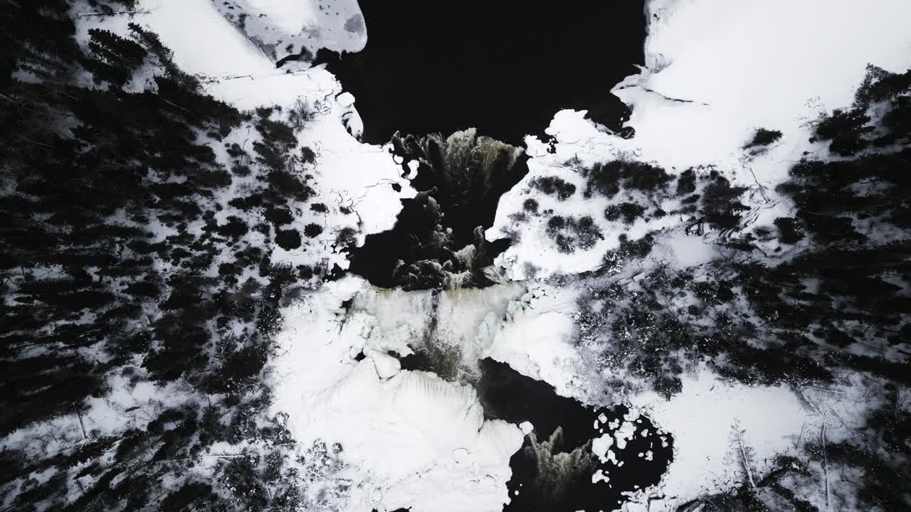 Cinematic Aerial Top Down Overhead 4K Drone Shot Frozen Winter Tourism Landmark Pisew Kwasitchewan Waterfall Provincial Park Thompson Manitoba Northern Arctic Canada
