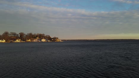 panning from the water to local lake homes
