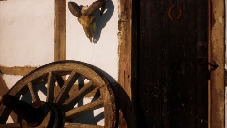 old-wood-wheel-and-black-door-at-white-house