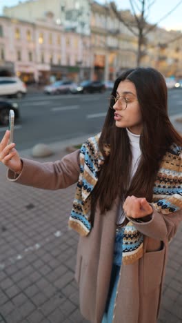 woman making a video call in the city