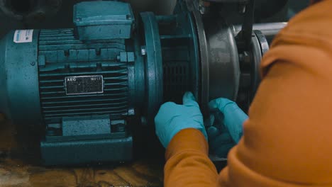 a worker in working with a water pump