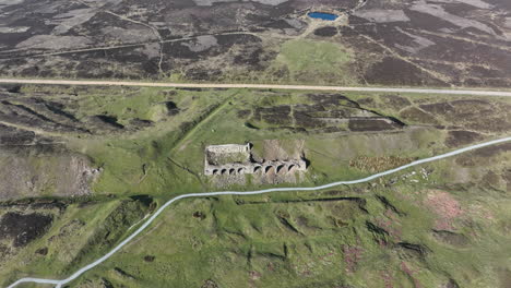 rosedale abbey iron calcining kilns, aerial footage, north york moors national park, aerial decent with pan upwards