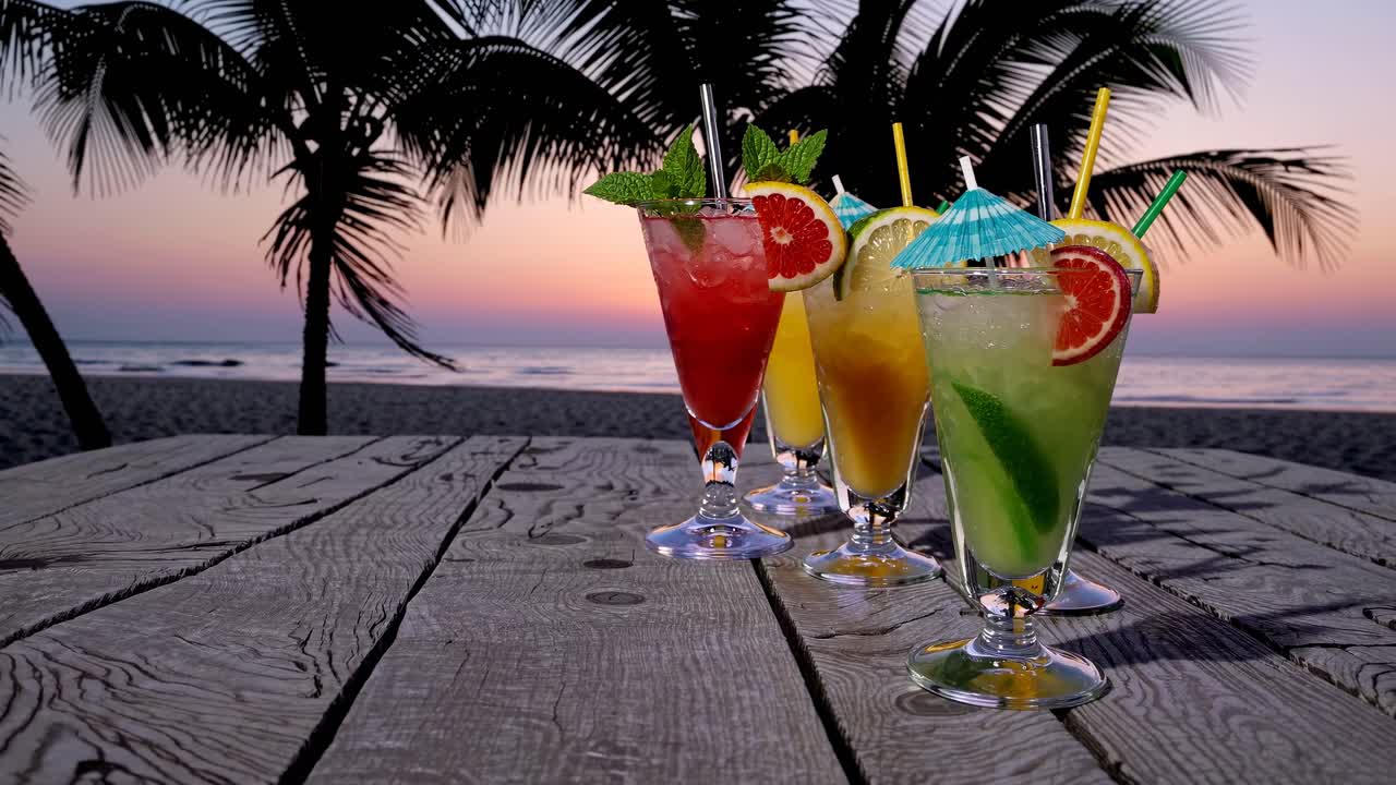 A vibrant video still of tropical cocktails on a wooden table, shot from a low angle, with a serene
