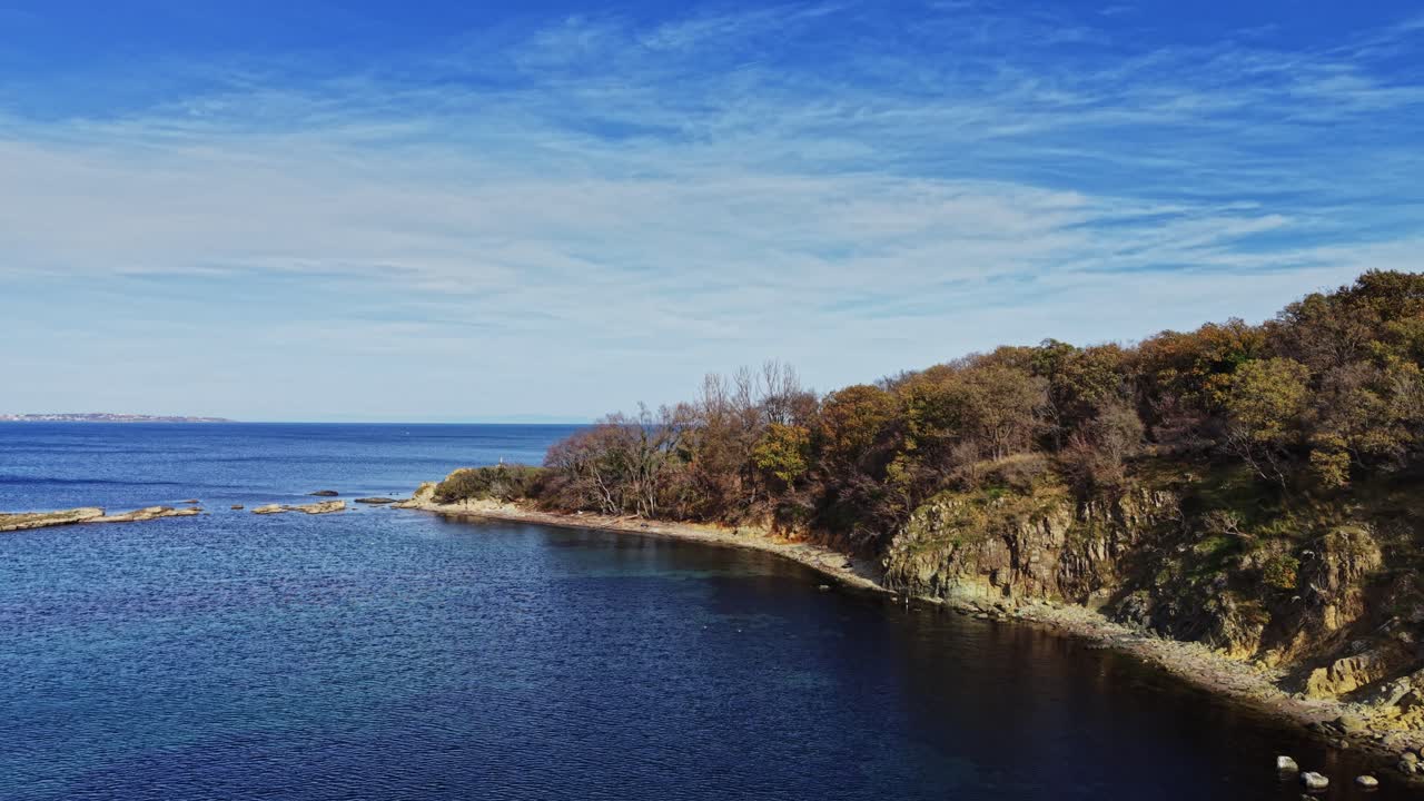 Vibrant coastal scenery with clear blue water and rocky shoreline