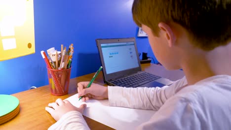 Profile-view-of-young-student-e-learning-at-home-during-quarantine