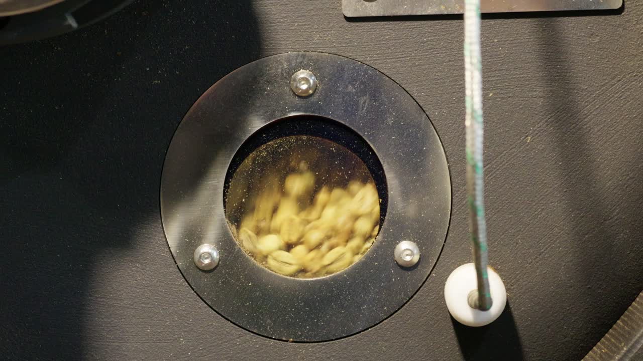 Witness the intricate roasting of coffee beans capturing the craft of drink-making with vibrant energy.