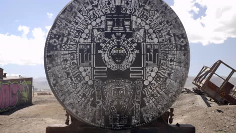 Ominous-dolly-shot-of-ancient-ritual-markings-on-abandoned-train-in-Uyuni,-Bolivia