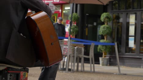 Medium-Shot-from-Behind-Busker-On-Cornmarket-Street-In-Oxford