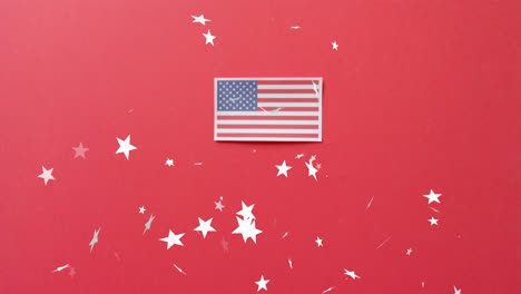 animation of stars falling over flag of united states of america on red background