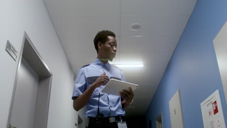 man in uniform working in the corridor