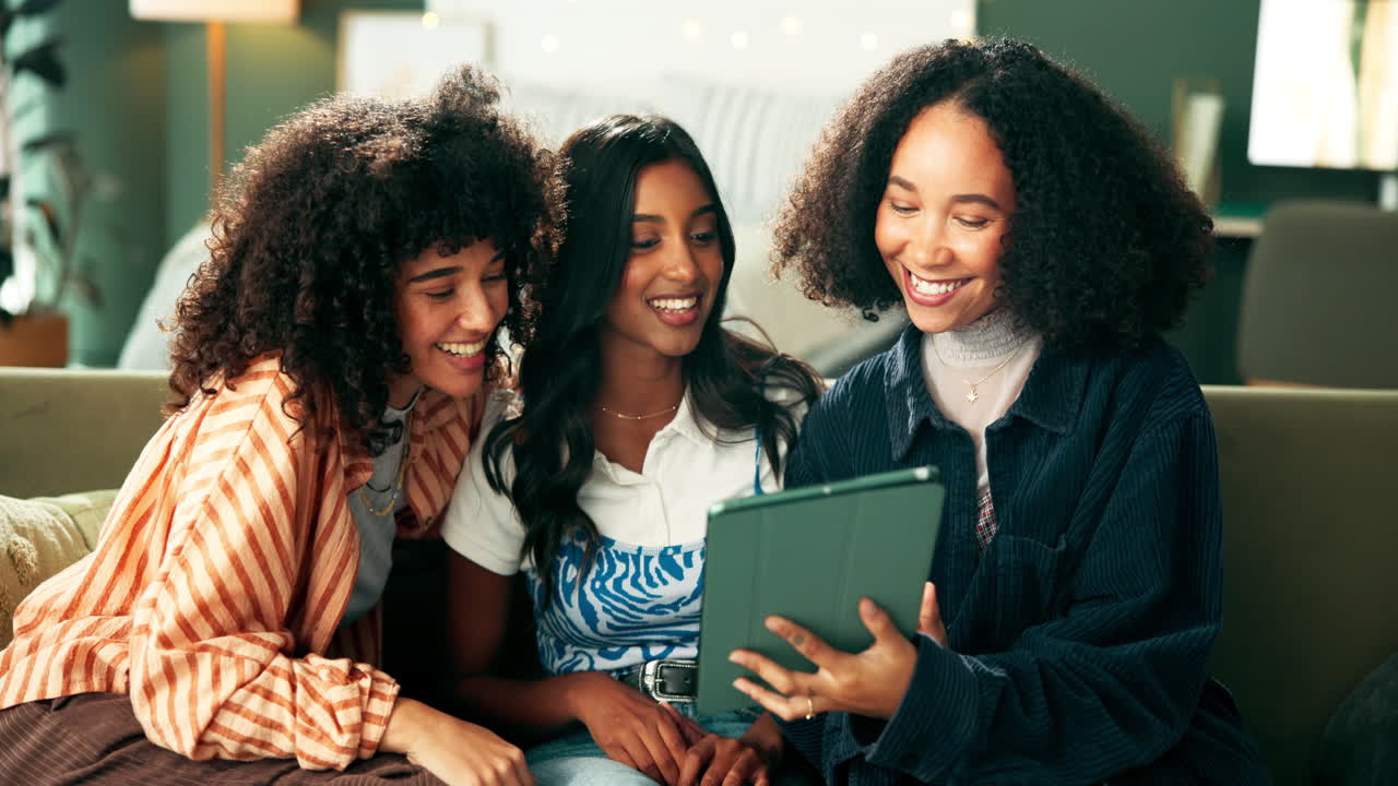 Three friends having a video call using a tablet