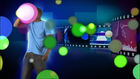 Moving-spots-of-coloured-light-with-singer-and-colourful-clips