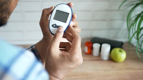 person checking blood glucose level