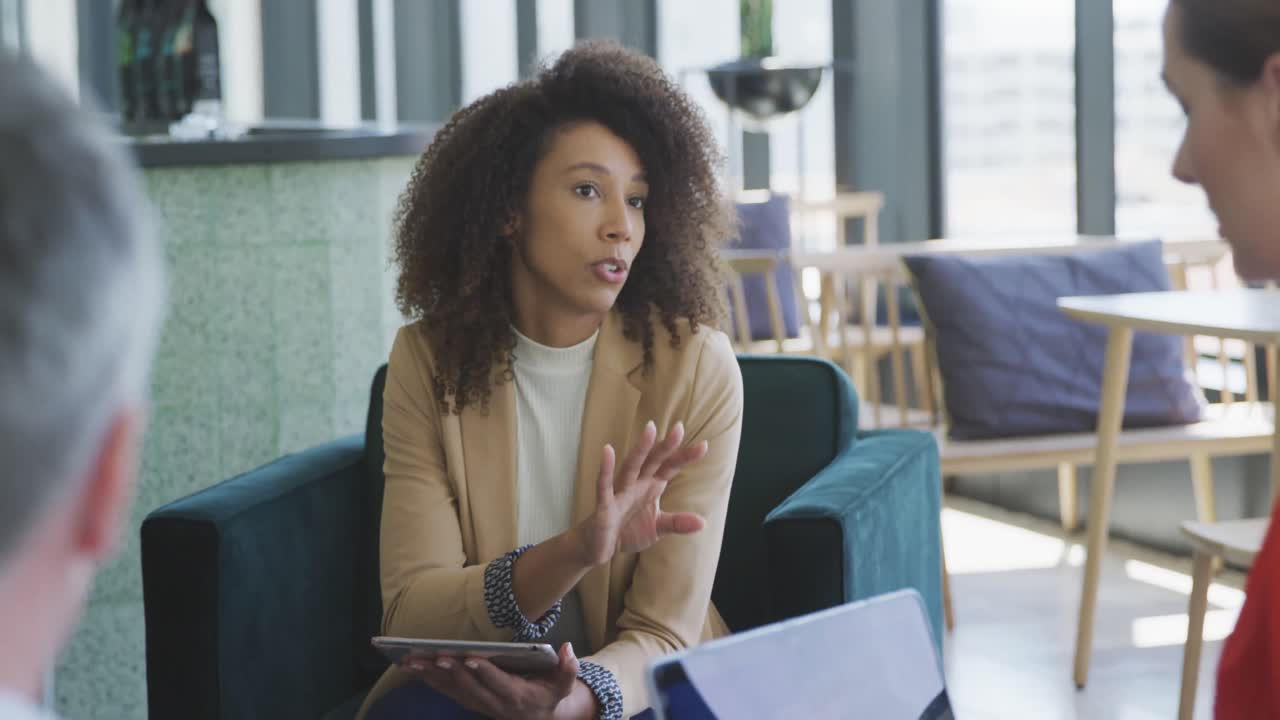 Colleagues discussing in the office