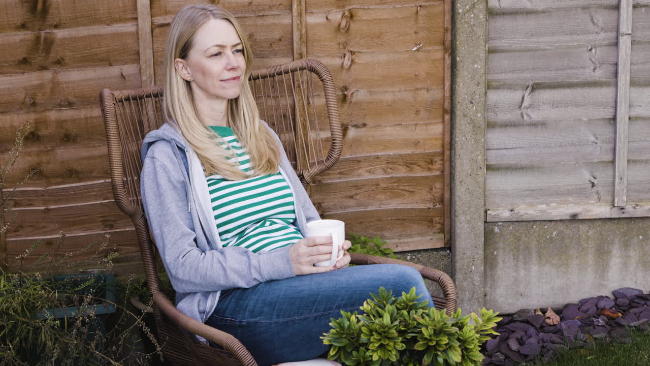 Woman relaxing in a chair outdoors