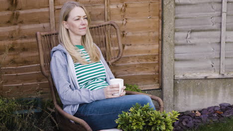 woman relaxing in a chair outdoors