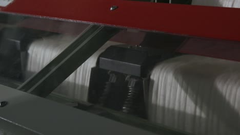 Weaving-mechanism-is-fabricating-cloth-from-coloured-threads